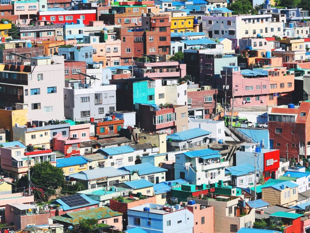 Pastel houses stacked up the hillside of Gamcheon Culture Village in Busan