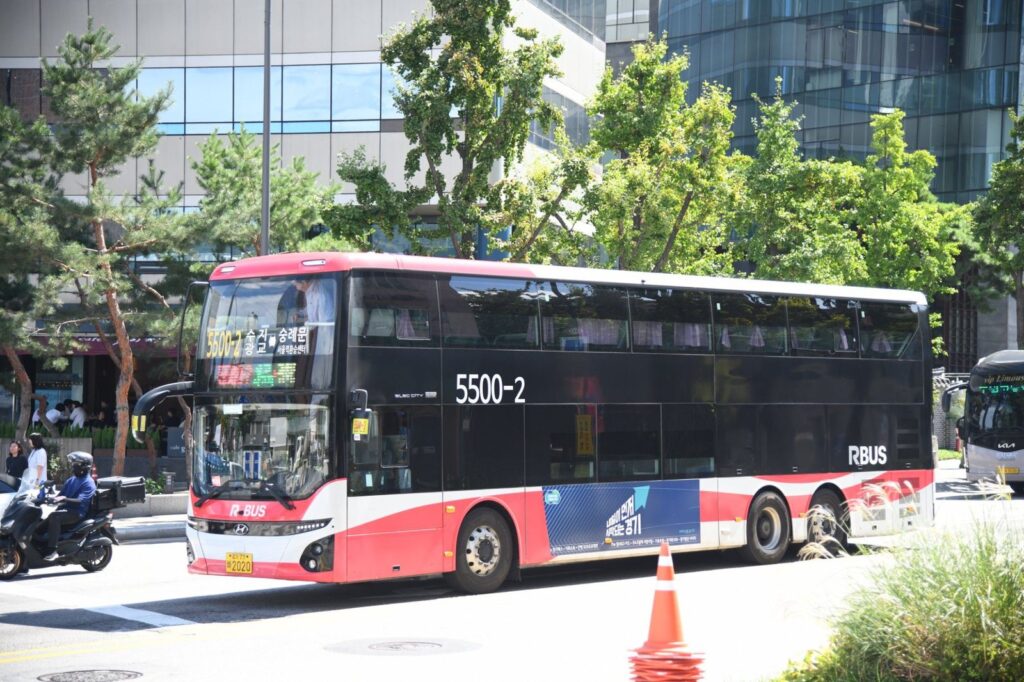 A red double-decker commuter bus bound for Suji and Gwanggyo in central Seoul